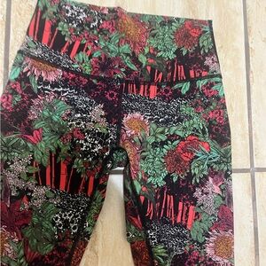 Lululemon women’s leggings - red, green, black, orange, white vibrant colors.